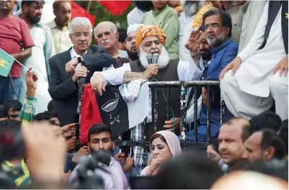  ?? AFP ?? Opposition leader Maulana Fazlur Rehman addresses protesters outside the Election Commission office against the alleged election rigging in Islamabad. —