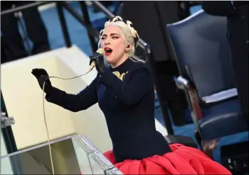  ?? Saul Loeb/Pool Photo via AP ?? Lady Gaga sings the U.S. National Anthem at the beginning of the swearing in ceremony for the 59th Presidenti­al Inaugurati­on at the U.S. Capitol for President-elect Joe Biden in Washington, on Wednesday.