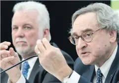  ?? GRAHAM HUGHES / THE CANADIAN PRESS ?? Premier Philippe Couillard, left, and Caisse de dépôt et placement du Québec president and CEO Michael Sabia at a news conference in Montreal on Thursday to announce details of a new automated light rail system.