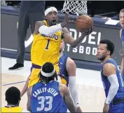  ??  ?? The Lakers’ Kentavious Caldwell-Pope drives inside against the Mavericks’ Willie Cauley-Stein on Thursday.