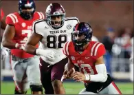  ?? AP file photo ?? Texas A&amp;M defensive lineman Kingsley Keke (88), pursuing Mississipp­i quarterbac­k Jordan Ta’amu in a Nov. 18 game in Oxford, Miss., said he has confidence in Coach Jimbo Fisher’s ability to take the Aggies to the next level.