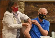  ??  ?? Gov. Asa Hutchinson receives a flu vaccinatio­n from Neldia Dycus, a registered nurse for the Arkansas Department of Health, in the governor’s conference room Wednesday at the Capitol in Little Rock. (Arkansas Democrat-Gazette/Staci Vandagriff)