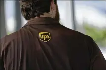  ?? ROGELIO V. SOLIS/AP 2021 ?? Sandy Springs-based UPS is among 33 companies vowing to hire and train refugees fleeing Afghanista­n for the U.S. to help them integrate into the economy. The move comes as employers struggle to fill job openings amid a nationwide labor shortage.