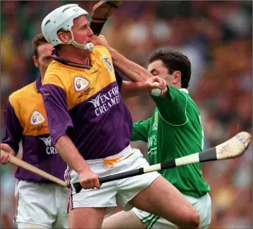  ??  ?? Tom Dempsey beats Limerick defender Declan Nash to the ball in the All-Ireland Senior final of 1996.