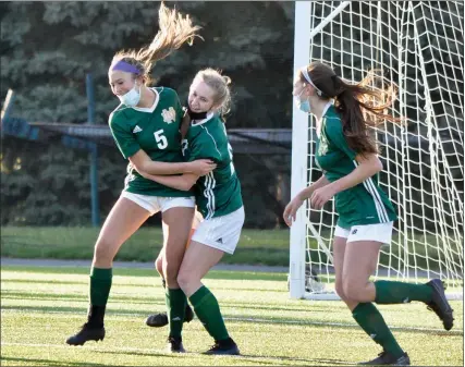  ?? PHOTOS BY DAN FENNER — FOR MEDIANEWS GROUP ?? Pontiac Notre Dame Prep celebrates a goal by Mary Timko (5) in the first half of a 4-1victory over Troy on Thursday.