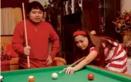  ?? ANDREW TADALAN ?? PLAYING billiards with brother Carl in her Tagaytay home in 2009