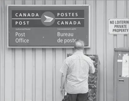  ?? DARREN CALABRESE, THE CANADIAN PRESS ?? Mailing a letter through Canada Post: To reverse what Canada Post has already done on home delivery would be folly.