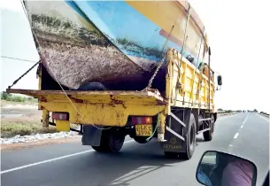  ??  ?? A single-day boat being taken to Jaffna to be converted to a bottom trawler