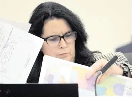  ?? PHELAN M. EBENHACK AP ?? State Sen. Kelli Stargel looks through redistrict­ing maps during a Senate Committee on Reapportio­nment hearing on Jan. 13 in Tallahasse­e.