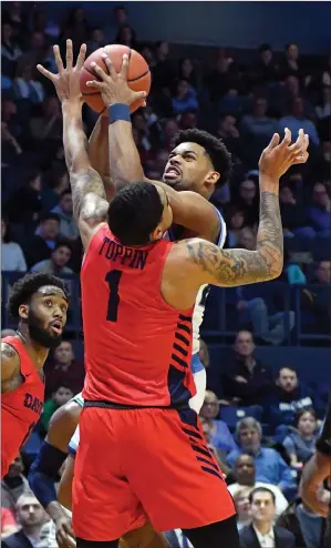  ?? Photo by Michael Derr / The Independen­t ?? Dayton forward Obi Toppin (1) scored 19 points and pulled down four rebounds to lead the Flyers to a 77-48 throttling of Rhode Island at the Ryan Center Saturday afternoon.