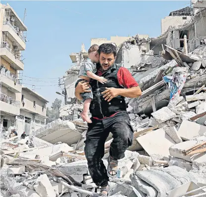  ??  ?? A man carries a baby from the rubble in the Qatarji neighbourh­ood of Aleppo