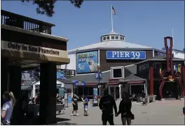  ?? JEFF CHIU — THE ASSOCIATED PRESS FILE ?? People visit Pier 39 during the coronaviru­s outbreak in San Francisco.