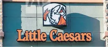  ?? ASSOCIATED PRESS FILE ?? Pizza prices from six of the largest national pizza places — including Little Caesars — were factored into the report.