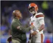  ?? PAUL SANCYA — THE ASSOCIATED PRESS FILE ?? Coach Hue Jackson talks with DeShone Kizer during the Browns’ loss to the Lions on Nov. 12 in Detroit.