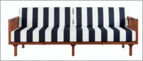  ?? CB2 VIA AP ?? This photo provided by CB2 shows a French Riviera-chic Tropez sofa in bold black and white cabana stripes and a mahogany frame create.