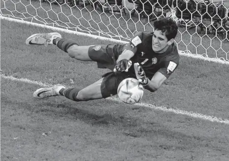  ?? Alexander Hassenstei­n/getty Images ?? Morocco goalkeeper Yassine Bounou of Morocco makes a save on a penalty kick by Spain's Carlos Soler during Tuesday's match.