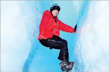  ?? COURTESY OF LEE ABBAMONTE ?? Lee Abbamonte, who has visited more than 100 countries alone, explores the ice caves beneath the surface of Queen Maud Land in Antarctica.