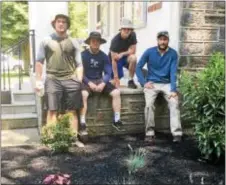  ?? PEG DEGRASSA — DIGITAL FIRST MEDIA ?? The volunteers who beautified the grounds of Glenolden Library last week take a much-deserved break in the shade to admire their work. The crew pulled out 70-year-old shrubs and mulched and replanted the garden beds with Soft Touch Holly, Cherry...