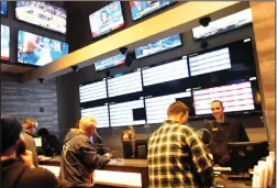  ?? Ernest A. Brown file photo ?? Sportsbook Bar and Grill, in Twin River Casino in Lincoln, has been a beehive of activity since introducin­g sports betting late last year.