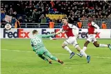  ?? AP ?? Arsenal’s Aaron Ramsey scores his side’s second goal during the Europa League quarterfin­al against Moscow.