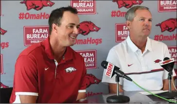  ?? NWA Democrat-Gazette/J.T. Wampler ?? NEWEST HOG: Arkansas coach Dave Van Horn, right, and new assistant coach Nate Thompson take questions from the press at Baum Stadium in Fayettevil­le on Wednesday. Thompson formerly coached at Missouri State, which knocked the Razorbacks out of the NCAA...
