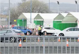  ??  ?? Testing station Cars line up at the hub created close to Glasgow Airport