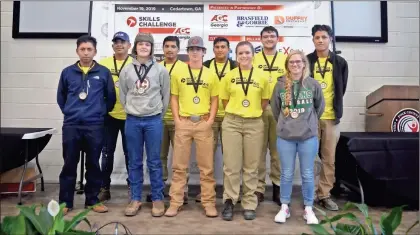  ?? Contribute­d ?? Gordon Central high School students Cody McNeese (front row, third from left) and Kevin Fraire (back row, far right) pose with other event winners after the 2019 Northwest Skills Challenge.