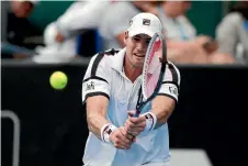  ?? PHOTO: GETTY IMAGES ?? American John Isner plays a backhand shot during in his match against Malek Jaziri, of Tunisia, at the ASB Classic yesterday.