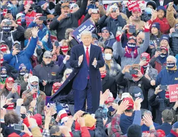  ?? CARLOS OSORIO/AP ?? President Trump arrives at a campaign rally Saturday in Norton Shores, Michigan, a state that may be slipping from him.