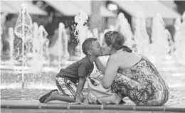  ??  ?? Fountain Park is a great spot to keep cool at Westgate. There also are free evening concerts on-site.