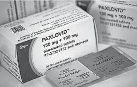  ?? FABIAN SOMMER/PICTURE ALLIANCE VIA GETTY IMAGES ?? Price worries, bureaucrat­ic obstacles and “I’m-over-COVID-itis” are slowing use of Paxlovid, a drug that’s complicate­d to take but often effective.