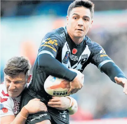  ?? Photo / Photosport ?? Halfback Kodi Nikorima turned in a man of the match display as the Kiwis thrashed England 34-0 in the third test.