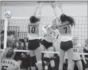  ?? Medicine Hat News photo by Ryan McCracken ?? Medicine Hat Rattlers outside hitter Brooke Christie hits a shot through the block of Lethbridge Kodiaks Carley Doneff (10) and Grace Kazanowski (7) during Thursday’s Alberta Colleges Ahtletic Conference women’s volleyball game at the Snake Pit.