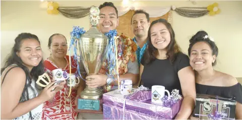  ??  ?? Family members of the Grammarian dux of the year stand proudly beside Century Upolu Va’ai with his awards yesterday.