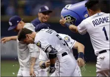  ?? AP PHOTO / CHRIS O'MEARA ?? Tampa Bay Rays' Matt Duffy (5) gets doused with water by Willy Adames (1) after hitting the game-winning RBI single off Toronto Blue Jays relief pitcher Ryan Tepera in the ninth inning of a baseball game Wednesday in St. Petersburg.