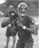  ??  ?? Ravens quarterbac­k Lamar Jackson runs a drill during practice July 23 in Owings Mills, Md. PATRICK SEMANSKY/AP