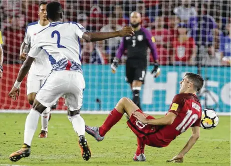  ?? Stephen M. Dowell / Tribune News Service ?? Panama’s Michael Murillo, left, throws Christian Pulisic of the United States to the ground, resulting in a yellow card for Murillo during Friday night’s World Cup qualifying match at Orlando, Fla.. The U.S. won 4-0 to keep its hopes alive of...