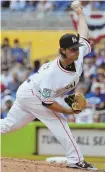  ?? AP PHOTO ?? MAKING A NAME: Dillon Peters delivers during the Marlins’ 6-0 win against the Cubs yesterday in Miami.