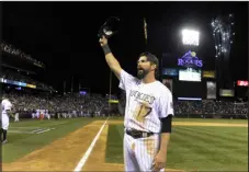  ?? JOHN LEYBA — DENVER POST FILE ?? Colorado’s Todd Helton acknowledg­es the crowd with a wave of his hat after taking a lap around Coors Field on Sept. 25, 2013.