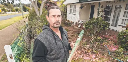  ?? Picture: Kevin Farmer ?? CLOSE CALL: Nigel Hill was lucky to escape uninjured after a car crashed through his South Toowoomba front yard, metres from where he and his partner were sleeping.