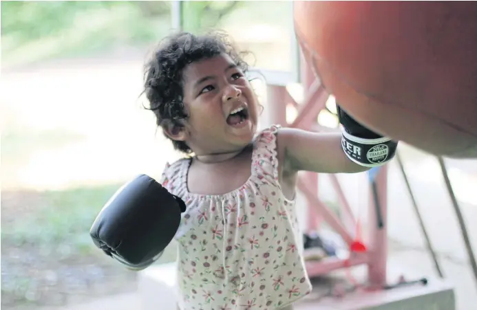  ??  ?? CAN’T BE BEAT: A young muay Thai trainee at the Wor Watthana gym in Ban Krabuang, Nakhon Ratchasima. The gym was opened by Frances and Thanit ‘Boom’ Watthanaya for village kids to train.