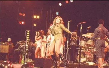  ?? Rhonda Graam HBO ?? TINA TURNER performs with the Ikettes in 1976, the year she fled her abusive husband and bandmate, Ike.