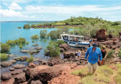  ??  ?? Above: Shore excursions are an exciting part of the Kimberley Quest II’s itinerary. Opposite, from
top: Gwion Gwion rock art is only found in the Kimberley region; passengers enjoying a beach bonfire.