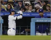  ?? RYAN SUN – THE ASSOCIATED PRESS ?? Dodgers manager Dave Roberts, right, saw Shohei Ohtani homer in back-to-back games,his first two HRs of 2024.