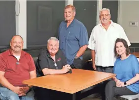  ?? DOUG HOKE/THE OKLAHOMAN ?? From left: Jack Bobbitt, district manager for Johnnie’s; Doug Cunningham, general manager of Edmond 33rd store; David Haynes, co-owner; Rick Haynes, co-owner; and Janet Estes, director of operations. Johnnie’s Charcoal Broiler celebrates 50 years this September.