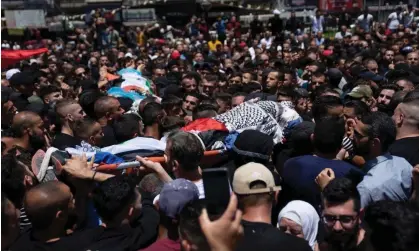  ?? Friday. Photograph: Nasser Nasser/AP ?? Palestinia­n mourners carry the bodies of Hamza Maqbul and Khairi Shaheen during their funeral in the West Bank city of Nablus on