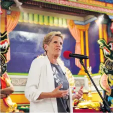  ?? COLE BURSTON/THE CANADIAN PRESS ?? Ontario Liberal Leader Kathleen Wynne speaks during a campaign stop at the Sri Ayyappan Hindu Temple in the Toronto suburb of Scarboroug­h on Sunday.