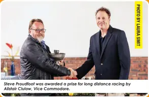  ?? ?? Steve Proudfoot was awarded a prize for long distance racing by Alistair Clulow, Vice Commodore.