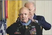  ?? Evan Vucci Associated Press ?? PARIS DAVIS receives the Medal of Honor, nearly 60 years after he was recommende­d for the award.