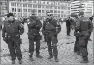  ?? AP/VESA MOILANEN ?? Police patrol Saturday in the market square of Turku, Finland, after Friday’s attack there.